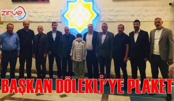 Başkan Dölekli’ye muhtarlardan plaket